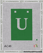 A taped needlepoint canvas with the design: Banner 18 mesh count Squared U White on Green.