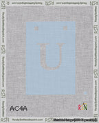 A taped needlepoint canvas with the design: Banner 18 mesh count Squared U White on Light Blue.