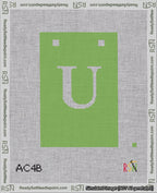 A taped needlepoint canvas with the design: Banner 18 mesh count Squared U White on Light Green.