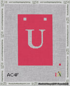 A taped needlepoint canvas with the design: Banner 18 mesh count Squared U White on Red.