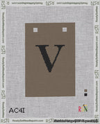 A taped needlepoint canvas with the design: Banner 18 mesh count Squared V Black on Brown.