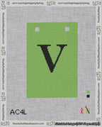 A taped needlepoint canvas with the design: Banner 18 mesh count Squared V Black on Light Green.