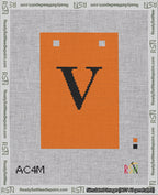 A taped needlepoint canvas with the design: Banner 18 mesh count Squared V Black on Orange.