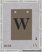 A taped needlepoint canvas with the design: Banner 18 mesh count Squared W Black on Brown.
