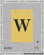 A taped needlepoint canvas with the design: Banner 18 mesh count Squared W Black on Yellow.