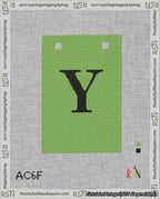 A taped needlepoint canvas with the design: Banner 18 mesh count Squared Y Black on Light Green.