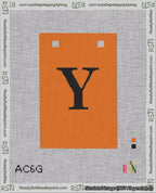 A taped needlepoint canvas with the design: Banner 18 mesh count Squared Y Black on Orange.