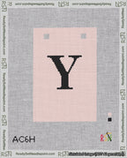 A taped needlepoint canvas with the design: Banner 18 mesh count Squared Y Black on Pink.