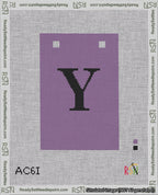 A taped needlepoint canvas with the design: Banner 18 mesh count Squared Y Black on Purple.