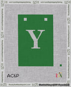A taped needlepoint canvas with the design: Banner 18 mesh count Squared Y White on Green.