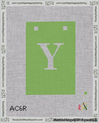 A taped needlepoint canvas with the design: Banner 18 mesh count Squared Y White on Light Green.