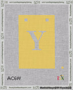 A taped needlepoint canvas with the design: Banner 18 mesh count Squared Y White on Yellow.