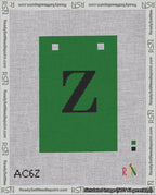 A taped needlepoint canvas with the design: Banner 18 mesh count Squared Z Black on Green.