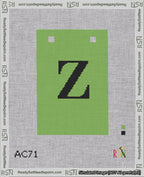 A taped needlepoint canvas with the design: Banner 18 mesh count Squared Z Black on Light Green.