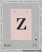 A taped needlepoint canvas with the design: Banner 18 mesh count Squared Z Black on Pink.