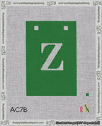 A taped needlepoint canvas with the design: Banner 18 mesh count Squared Z White on Green.