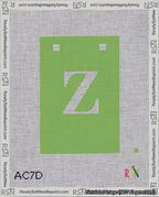 A taped needlepoint canvas with the design: Banner 18 mesh count Squared Z White on Light Green.