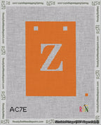 A taped needlepoint canvas with the design: Banner 18 mesh count Squared Z White on Orange.
