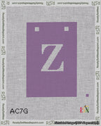 A taped needlepoint canvas with the design: Banner 18 mesh count Squared Z White on Purple.