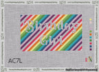 A taped needlepoint canvas with the design: Birthday Girl Bag Insert White on Rainbow.