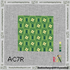 A taped needlepoint canvas with the design: Pickleball Paddles Green.