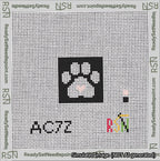A taped needlepoint canvas with the design: Square Cat Paw Print White On Black with Pink Heart.