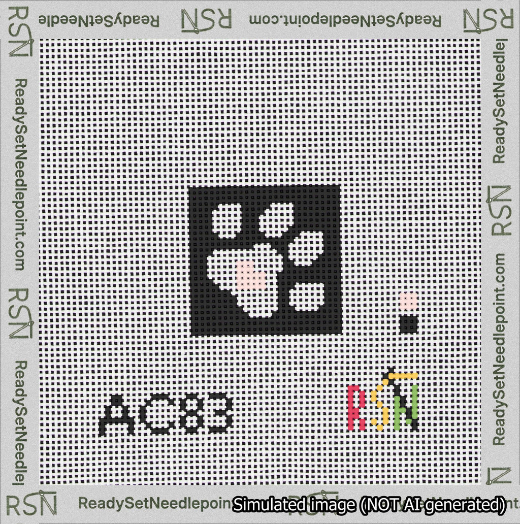 A taped needlepoint canvas with the design: Square Dog Paw Print White on Black with Pink Heart.
