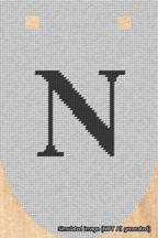 A simulated image of the stitched needlepoint design: Banner 18m Rounded N Black on White. Not A.I. generated.